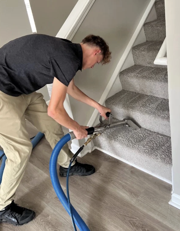 Nashville Steam Cleaning technician extracting a carpeted stairway